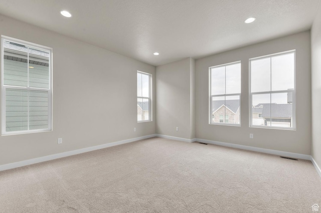 3903 W Red Clover Dr, Lehi, UT 84043 - spare room with light carpet, visible vents, and baseboards