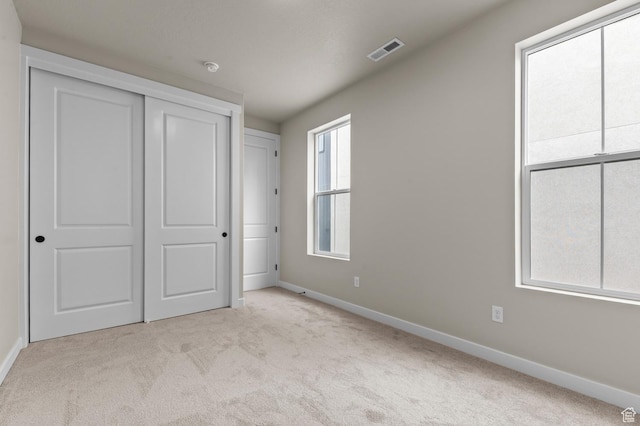 3903 W Red Clover Dr, Lehi, UT 84043 - unfurnished bedroom with baseboards, visible vents, and carpet floors