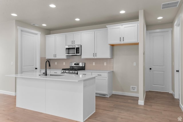 3903 W Red Clover Dr, Lehi, UT 84043 - kitchen with baseboards, visible vents, a sink, and appliances with stainless steel finishes