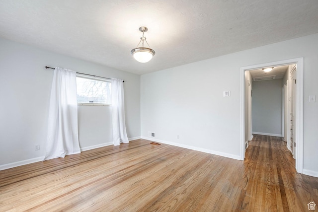 1425 W Riverside Cir, Salt Lake City, UT 84116 - unfurnished room with attic access, baseboards, and wood finished floors