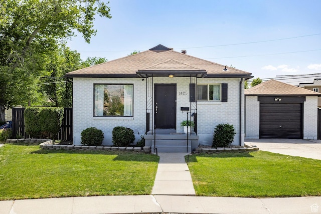1425 W Riverside Cir, Salt Lake City, UT 84116 - view of front of property featuring an outdoor structure, driveway, a front yard, and a garage
