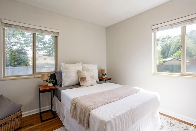1425 W Riverside Cir, Salt Lake City, UT 84116 - bedroom featuring baseboards and wood finished floors