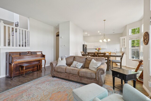2710 Forest Spring Way, Salt Lake City, UT 84106 - living room with an inviting chandelier, baseboards, recessed lighting, and wood finished floors
