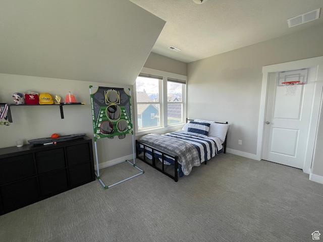 bedroom featuring baseboards, visible vents, and carpet flooring