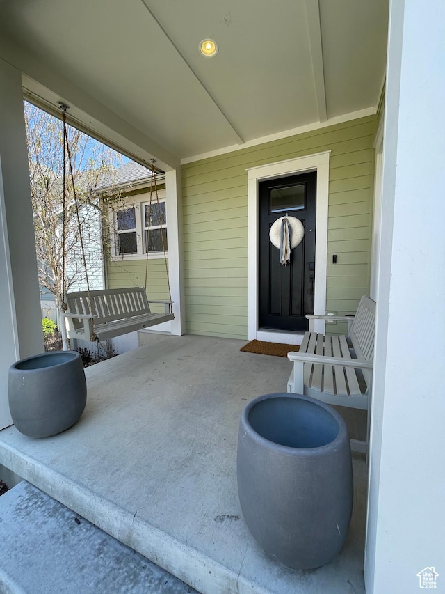 view of patio featuring a porch