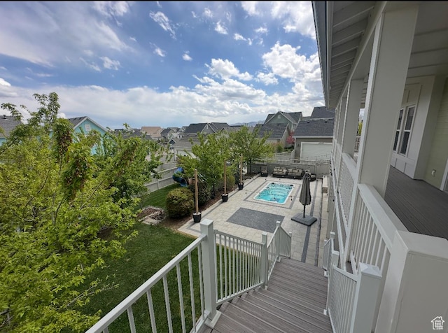 balcony featuring a patio area and a residential view