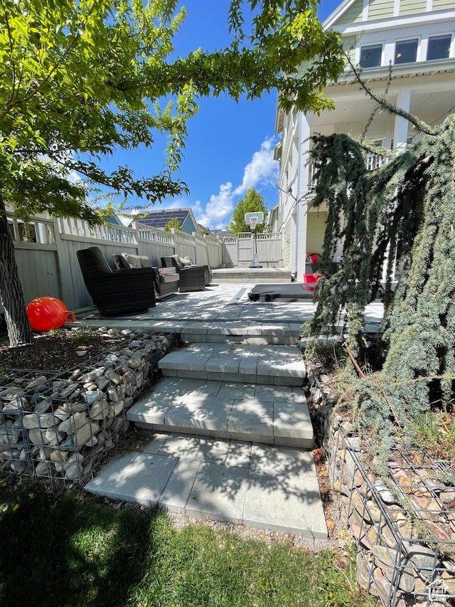 view of yard featuring outdoor lounge area, fence, and a patio area