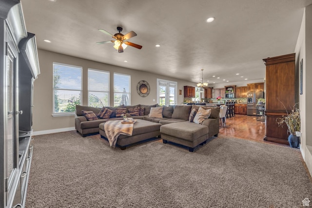 3627 W Augusta Dr, Syracuse, UT 84075 - living room featuring plenty of natural light, a ceiling fan, recessed lighting, a chandelier, and baseboards