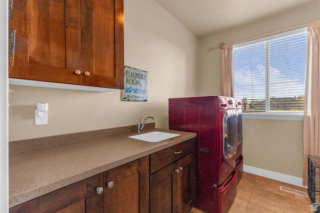 3627 W Augusta Dr, Syracuse, UT 84075 - laundry area with separate washer and dryer, cabinet space, baseboards, and light tile patterned floors
