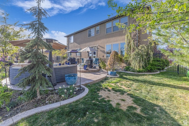 3627 W Augusta Dr, Syracuse, UT 84075 - rear view of house featuring a patio, stucco siding, and an outdoor hangout area