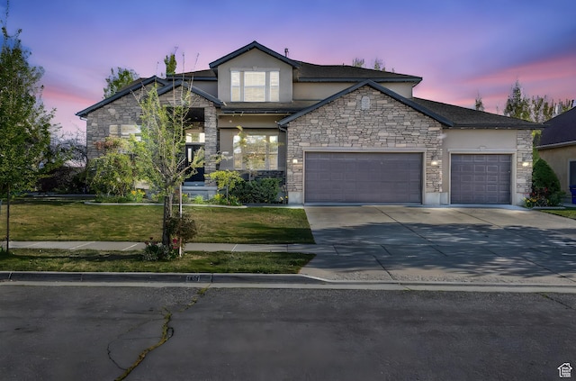 3627 W Augusta Dr, Syracuse, UT 84075 - view of front facade featuring stucco siding, a garage, stone siding, and a front yard