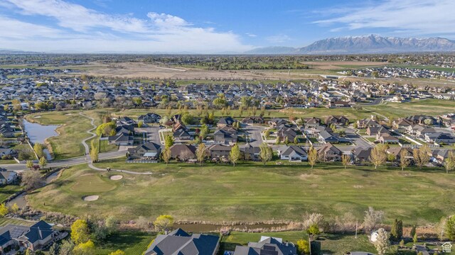 3627 W Augusta Dr, Syracuse, UT 84075 - aerial overview of property's location with nearby suburban area, a water and mountain view, and a golf course