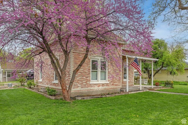290 N 300 E, Springville, UT 84663 - view of side of home with brick siding and a yard