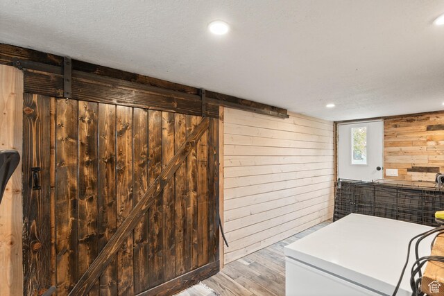 290 N 300 E, Springville, UT 84663 - below grade area featuring washer / dryer, wooden walls, light wood-style floors, and a barn door