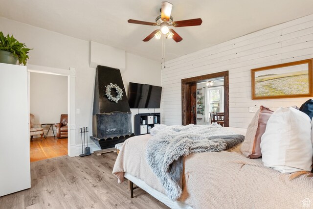 290 N 300 E, Springville, UT 84663 - bedroom featuring a ceiling fan, wooden walls, and light wood-type flooring