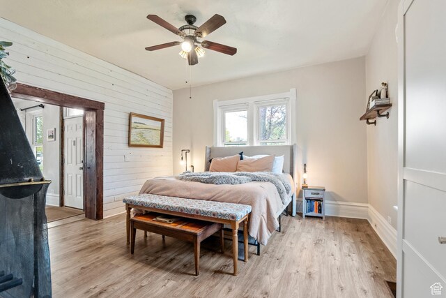 290 N 300 E, Springville, UT 84663 - bedroom featuring wooden walls, light wood-type flooring, a ceiling fan, and baseboards
