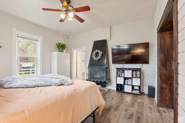 290 N 300 E, Springville, UT 84663 - bedroom featuring baseboards, ensuite bathroom, wood finished floors, and a fireplace