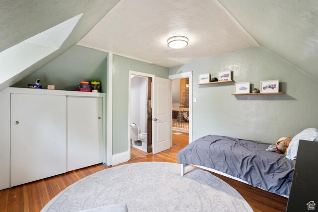 290 N 300 E, Springville, UT 84663 - bedroom with lofted ceiling, wood finished floors, a textured ceiling, and ensuite bathroom