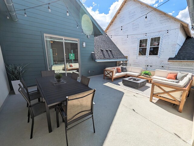 6807 W S Jordan Pkwy S Unit 251, South Jordan, UT 84009 - view of patio with outdoor dining space and an outdoor living space with a fire pit