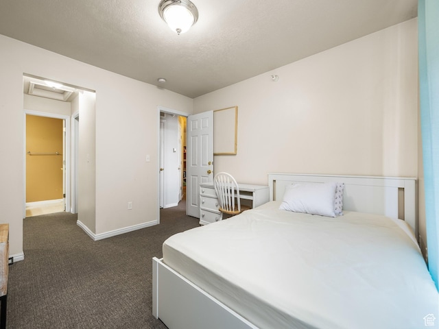 112 W Cougar Blvd N Unit 311, Provo, UT 84604 - bedroom with dark colored carpet, attic access, baseboards, and a textured ceiling