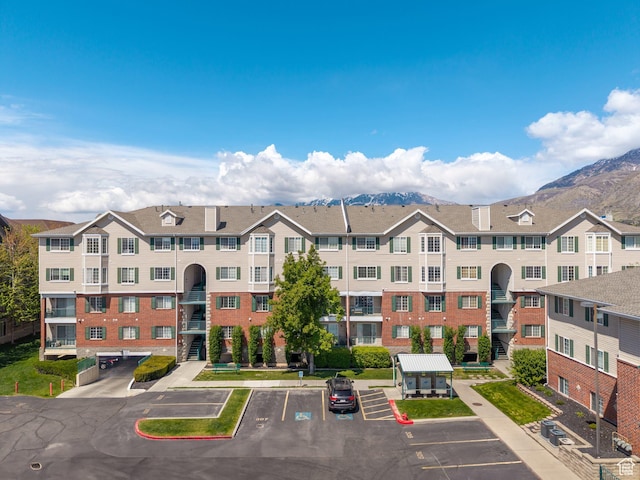 112 W Cougar Blvd N Unit 311, Provo, UT 84604 - view of building exterior with uncovered parking and a mountain view