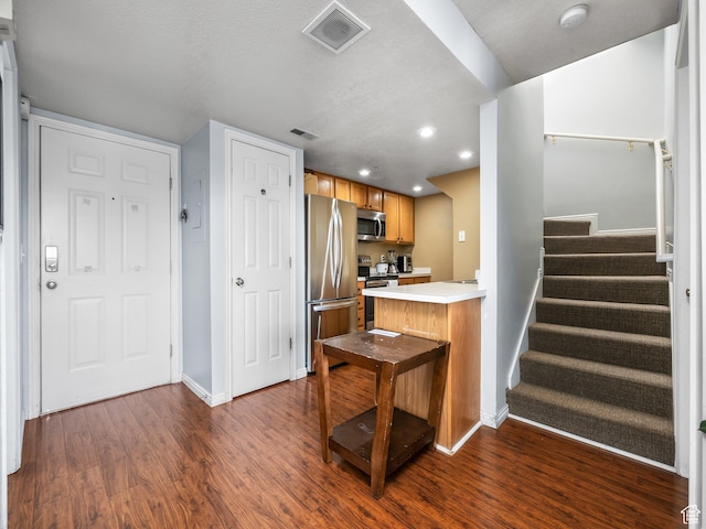 112 W Cougar Blvd N Unit 311, Provo, UT 84604 - kitchen featuring baseboards, dark wood finished floors, appliances with stainless steel finishes, and visible vents
