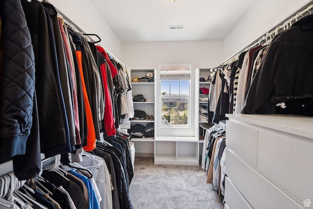 walk in closet featuring carpet floors and visible vents