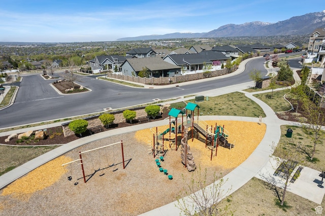 aerial view featuring a mountain view and a residential view