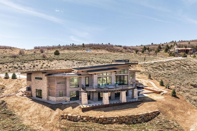 9881 N Uinta Dr, Kamas, UT 84036 - back of property featuring a wooden deck and a patio
