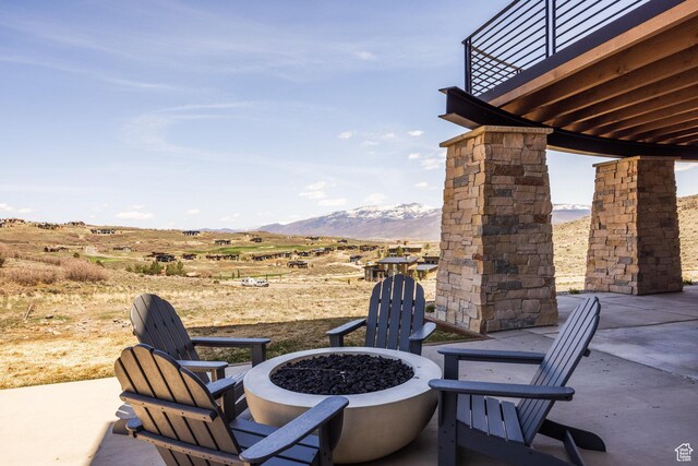 9881 N Uinta Dr, Kamas, UT 84036 - view of patio / terrace with a mountain view and an outdoor fire pit