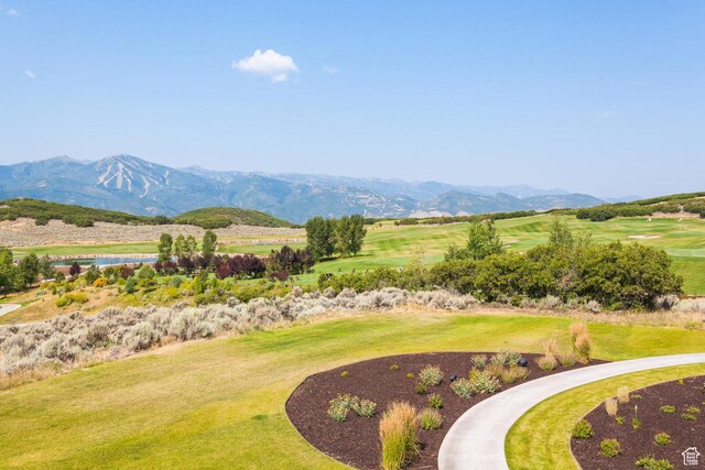 exterior space with a water view and view of golf course