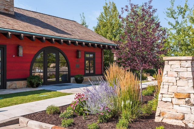 property entrance with french doors and a chimney