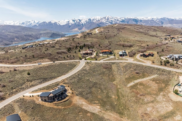 bird's eye view with a water and mountain view