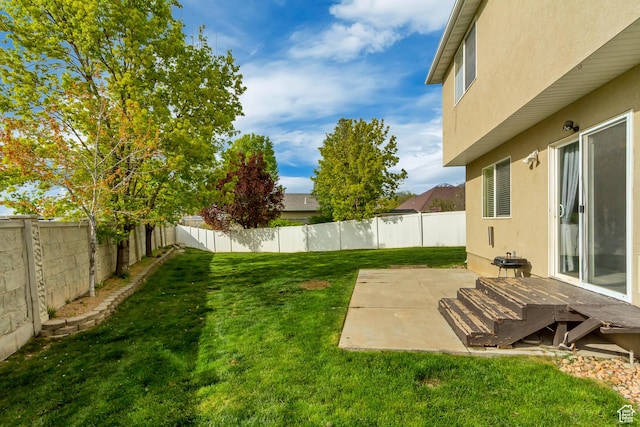view of yard with a fenced backyard and a patio