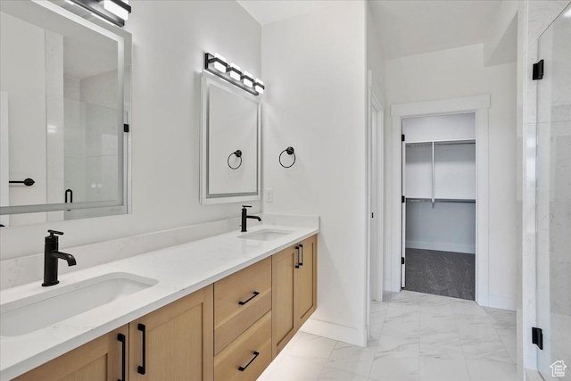 2649 N 3975 W, Plain City, UT 84404 - bathroom with baseboards, marble finish floor, a sink, and a walk in closet