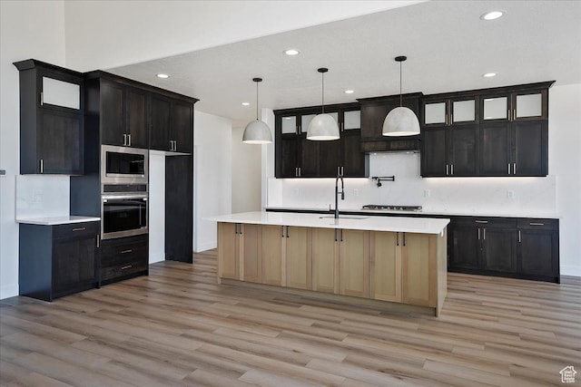 2649 N 3975 W, Plain City, UT 84404 - kitchen with a sink, light wood-type flooring, recessed lighting, light countertops, and appliances with stainless steel finishes
