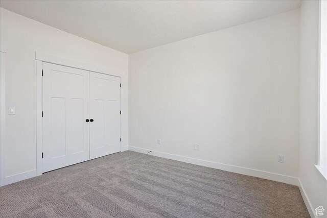2649 N 3975 W, Plain City, UT 84404 - unfurnished bedroom featuring baseboards, carpet flooring, and a closet