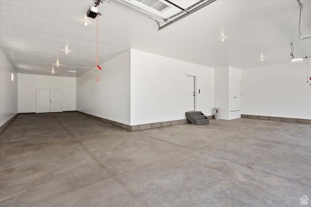 2649 N 3975 W, Plain City, UT 84404 - garage featuring a garage door opener and baseboards