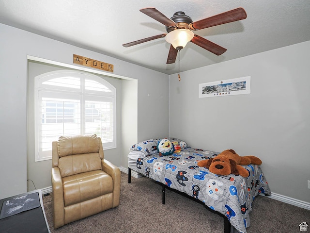 bedroom with baseboards, a ceiling fan, and carpet flooring