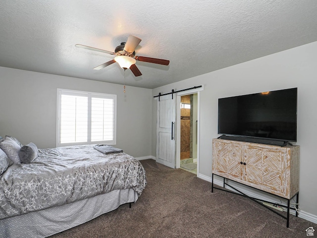 bedroom featuring a barn door, carpet floors, multiple windows, and baseboards