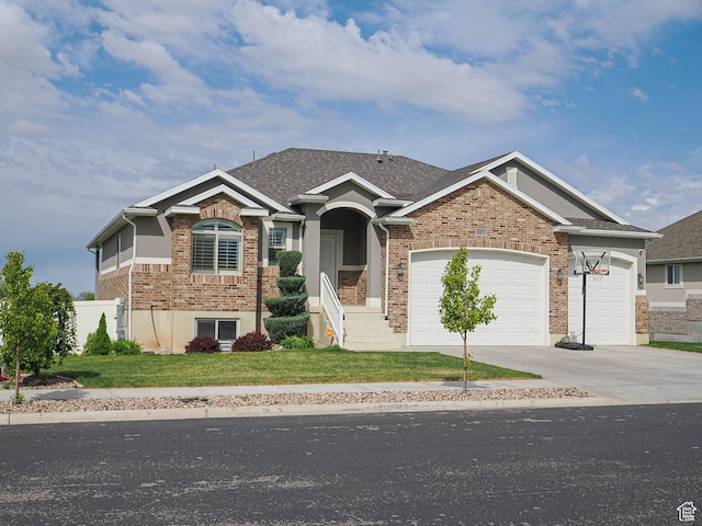 view of front of home featuring concrete driveway, a front lawn, brick siding, and a garage