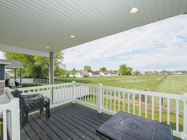 wooden deck with a yard