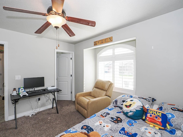 bedroom with a ceiling fan and carpet flooring