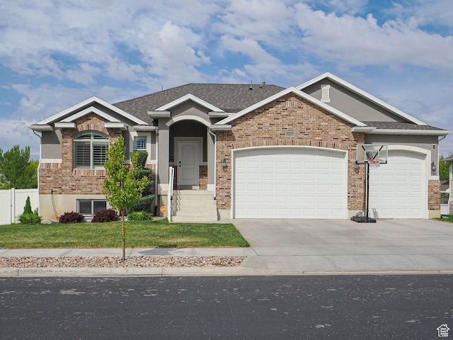 view of front facade featuring fence, stucco siding, driveway, a front yard, and a garage