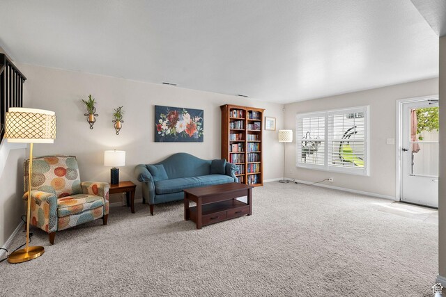612 E 3990 S, Murray, UT 84107 - carpeted living area with baseboards, a healthy amount of sunlight, and visible vents