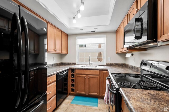 612 E 3990 S, Murray, UT 84107 - kitchen with a tray ceiling, a sink, dark countertops, visible vents, and black appliances