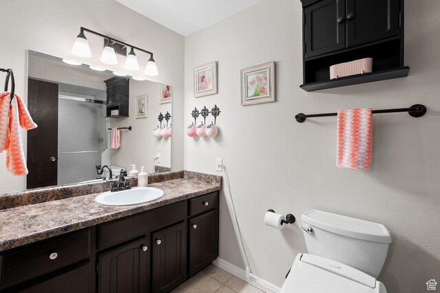 612 E 3990 S, Murray, UT 84107 - bathroom featuring vanity, a shower, baseboards, toilet, and tile patterned flooring