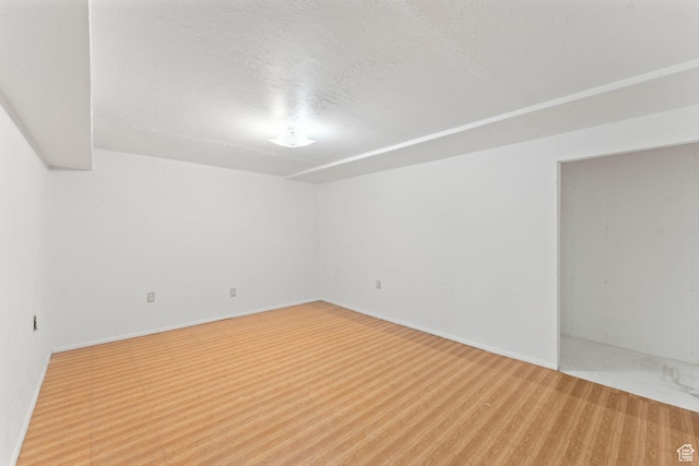 empty room featuring a textured ceiling