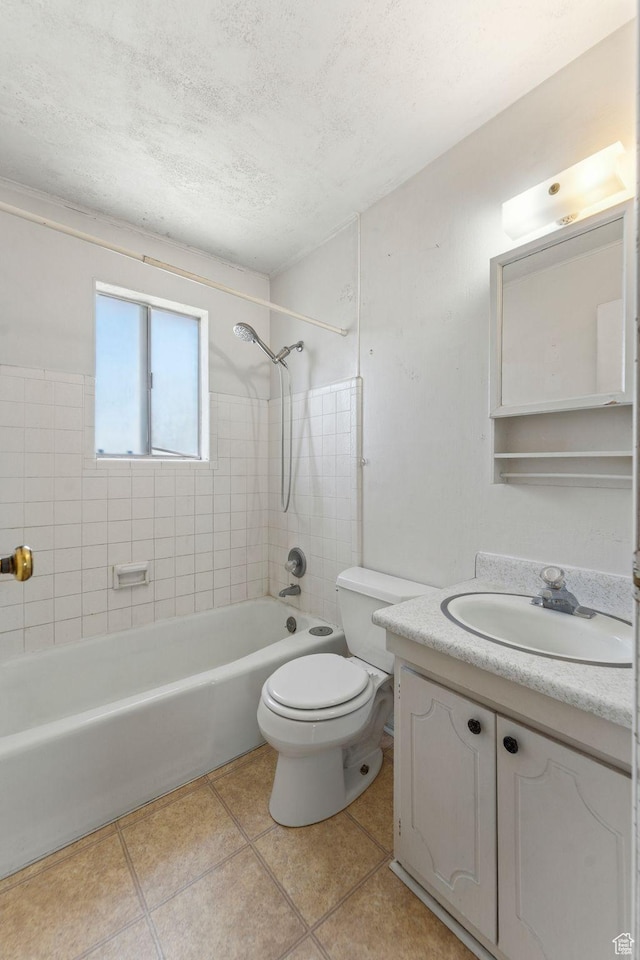 full bathroom featuring tile patterned flooring, vanity, toilet, a textured ceiling, and  shower combination