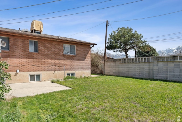 view of yard featuring a patio and fence